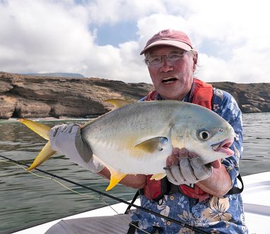 Angling holding a Permit Africanus