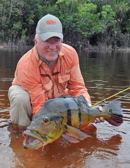 John Leonard with a peacock at the Rio Marie