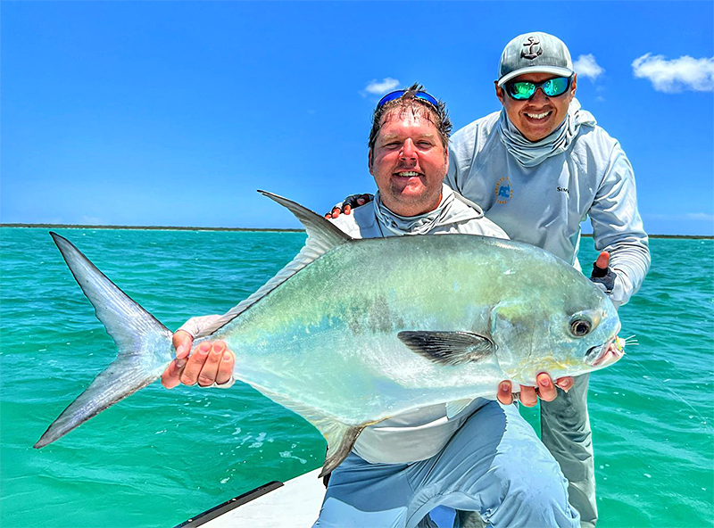 Angler holding large permit at ESB Lodge