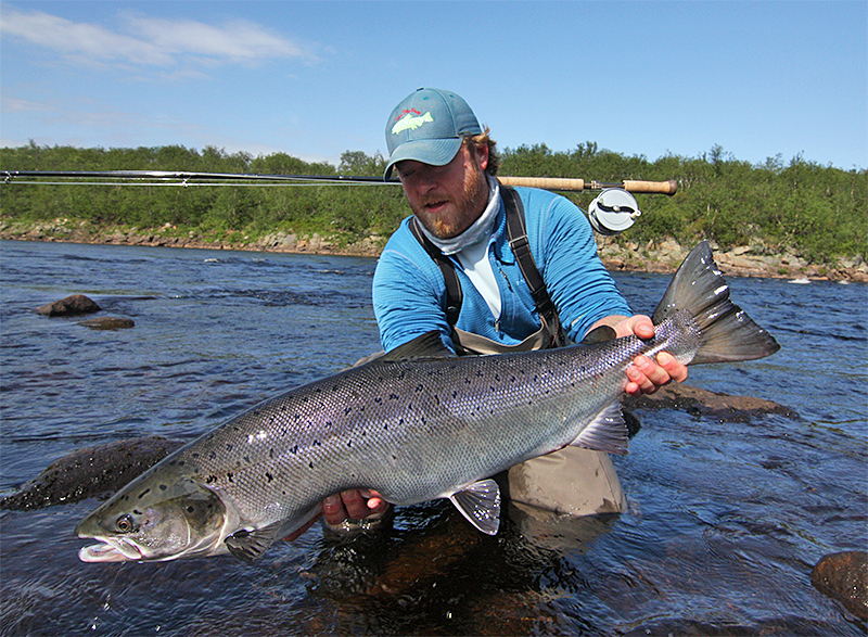 Justin Miller holding an Atlantic Salmon