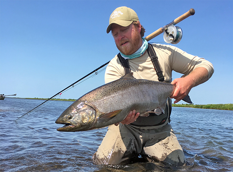 Justin Miller holding a Chinook at Lava Creek Lodge in Alaska