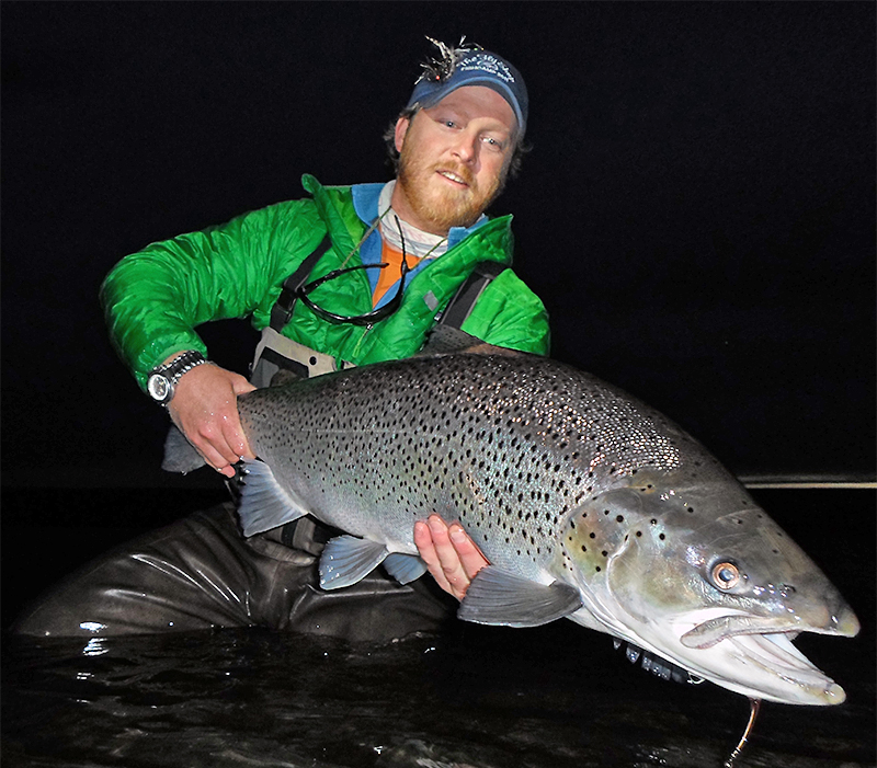 Justin Miller holding a Sea Trout in Tierra del Fuego