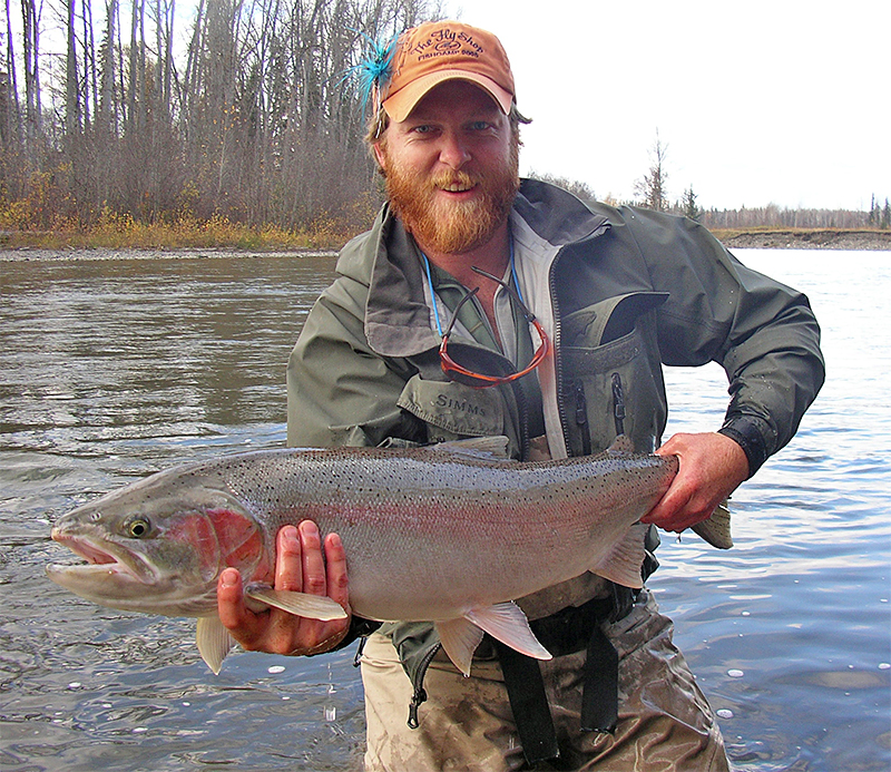 Justin Miller holding a steelhead