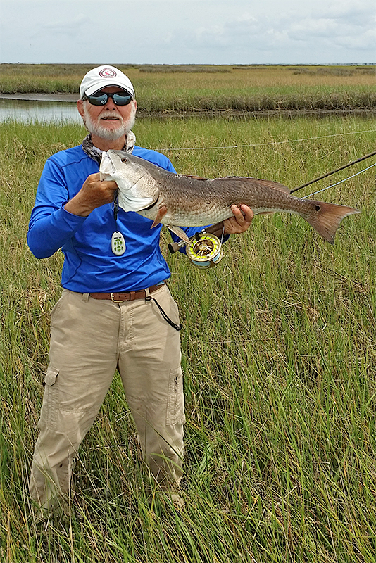 Don Causey holding a redfish