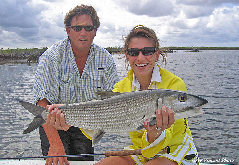 Angler holding large bonefish in the Bahamas