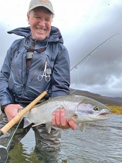 Pat Pendergast holding a steelhead on Pinnell Creek