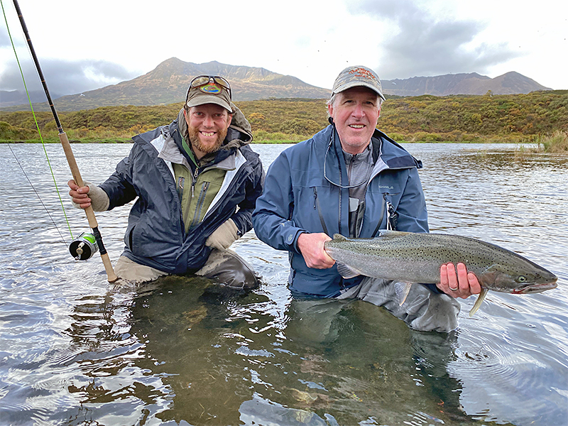 Pat Pendergast holding steelhead with Stig