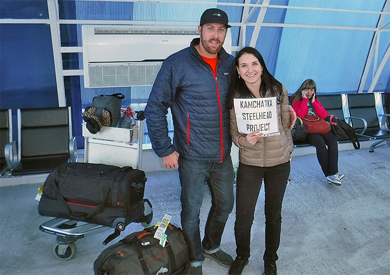 Greeting client with a sign at the airport