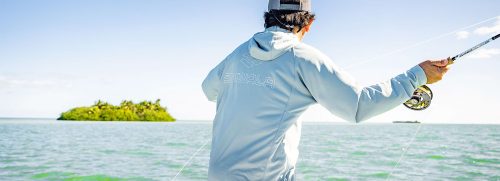 Angler casting while wearing Skwala Sol Tropic Hoody
