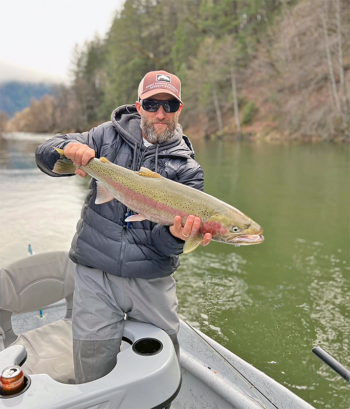 Gary Whitmire holding a steelhead