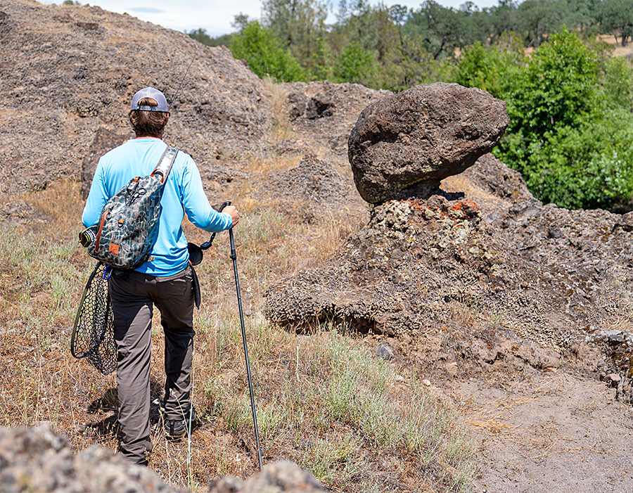 Angler walking with a wading staff