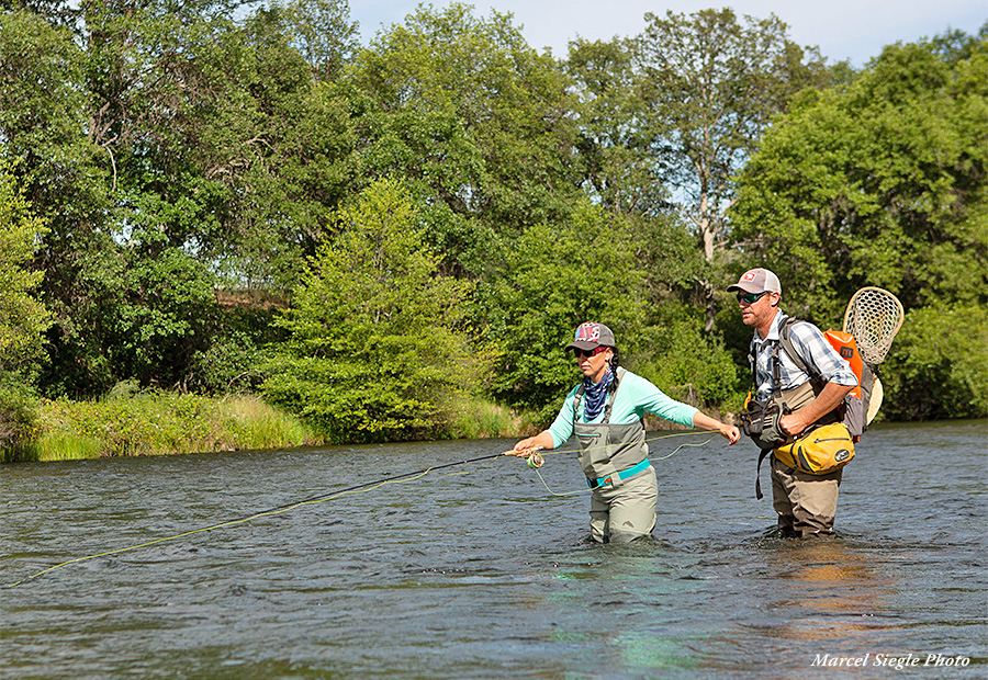 Woman angler fishing Hat Creek wearing a Damsel Fly Fishing wading belt