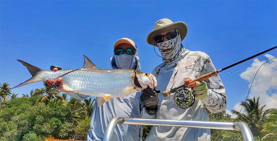 Lian and Bill Forrester holding a tarpon at ESB Lodge