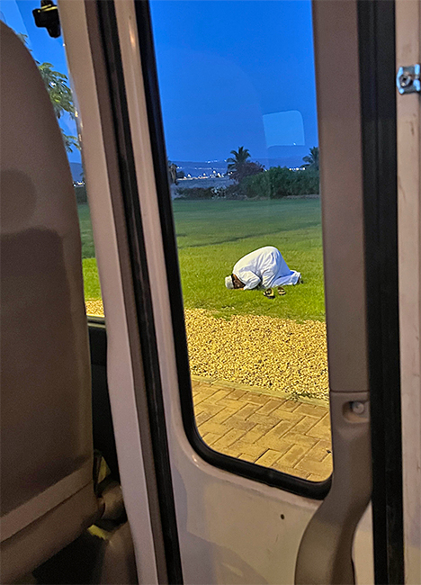 Transfer driver stopping for prayer on side of road