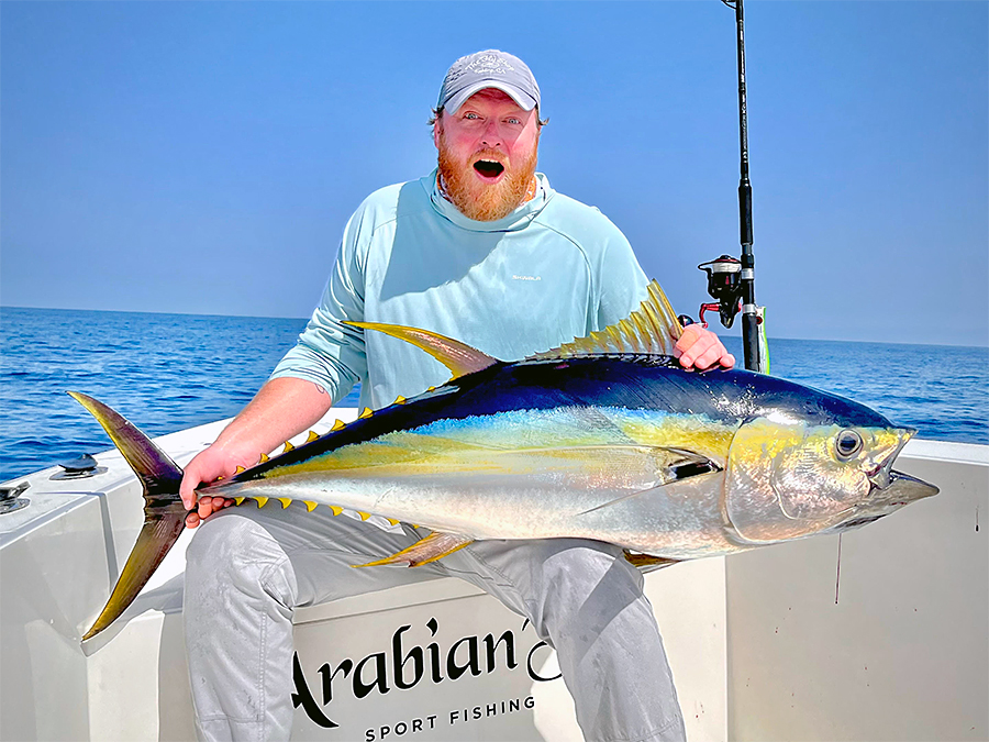 Justin Miller holding a yellowfin tuna