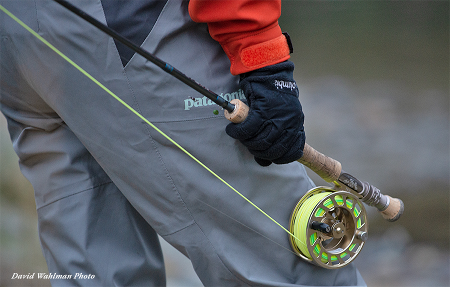 Angler holding The Fly Shop's Signature H2O Indicator fly rod and L2A reel
