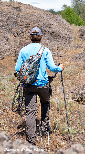 Angler walking with a wading staff