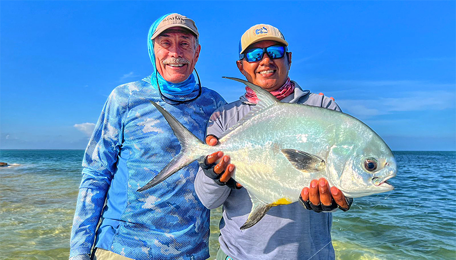Guide and angler with a permit at ESB Lodge