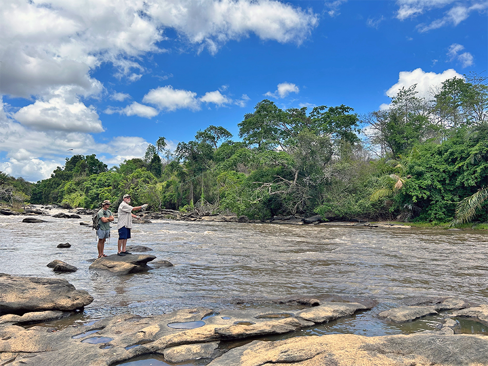 Angler and guide fishing the rapids section of the river