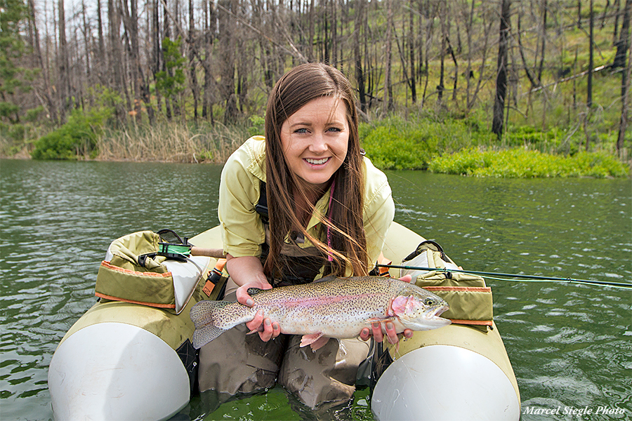 Christina Fasiano holding a fish at Rock Creek Lake