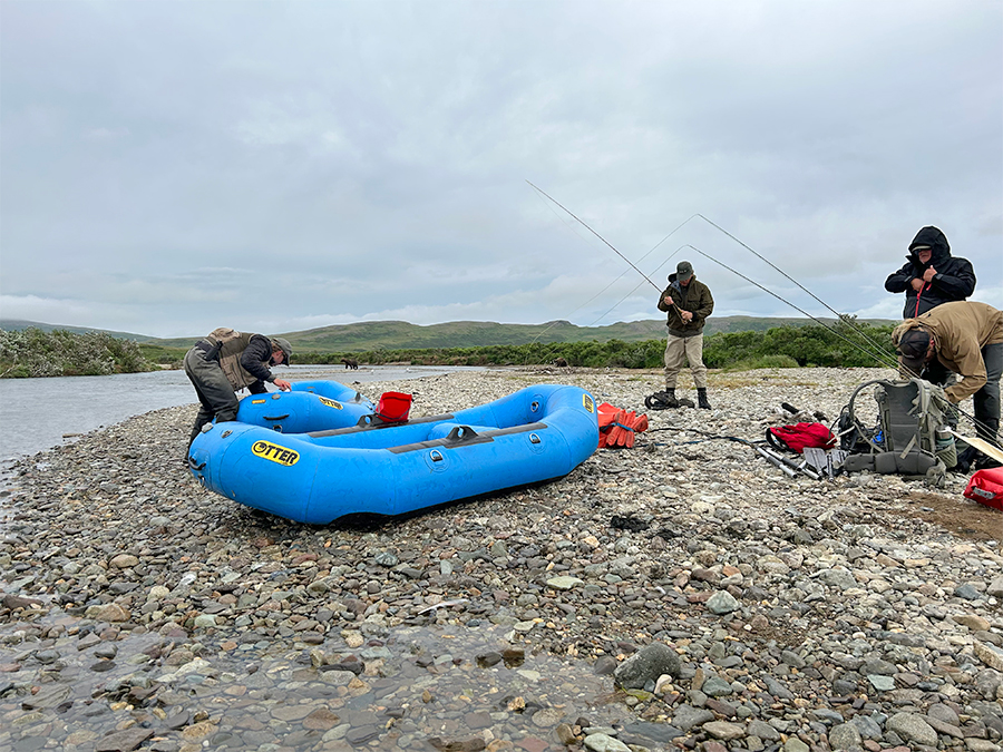 Guides inflating rafts while anglers gear up