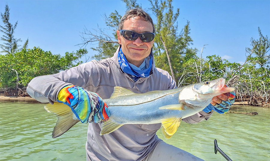 Angler holding a snook at ESB Lodge