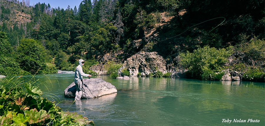 Bryan Quick wet wading the McCloud River in his Skwala Sol Wading Pants
