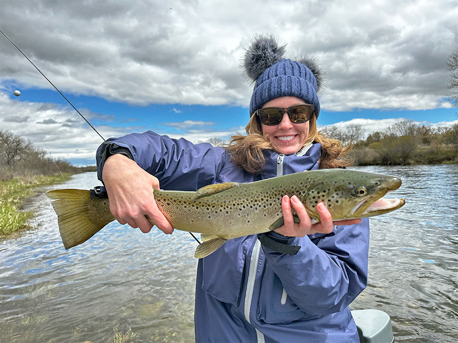 Beth holding a brown trout at Kingfisher