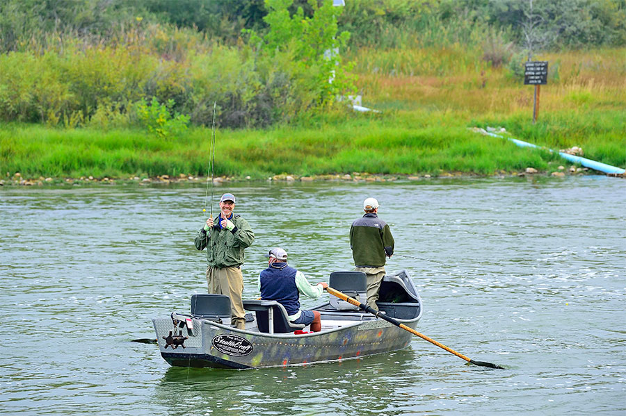 Anglers in a drift boat on the Bighorn at Kingfisher Lodge