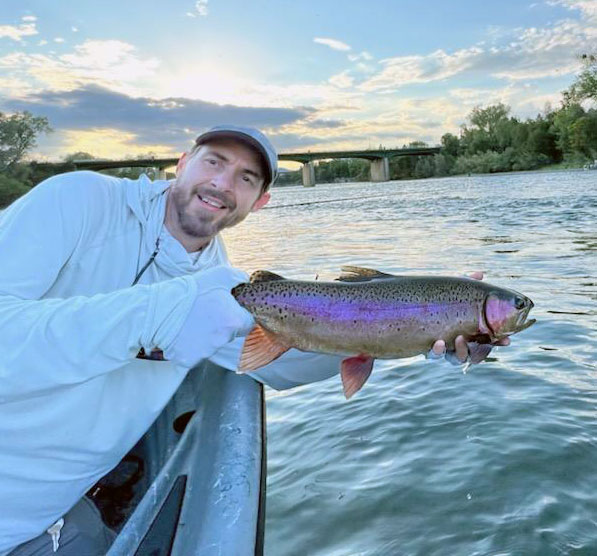 Eric Fields holding a rainbow trout on the Lower Sacramento River