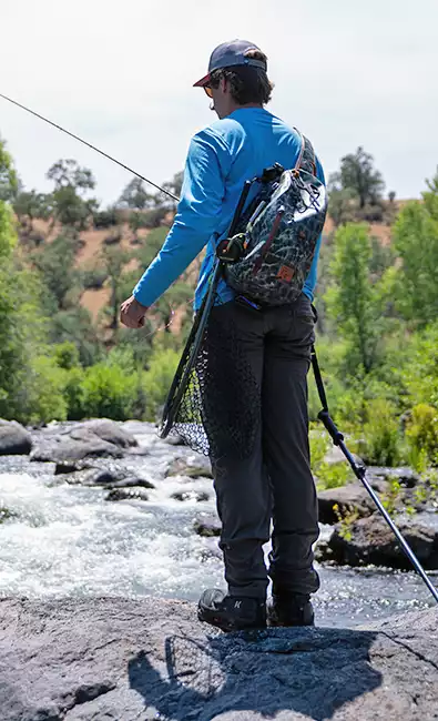 Jordan Taylor wearing a Fishpond Thunderhead Sling at Battle Creek Ranch