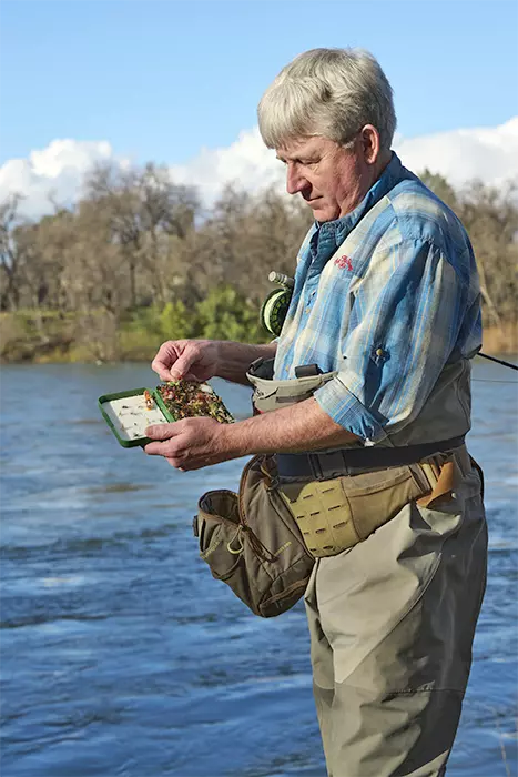 Mike Mercer selecting a fly from his fly box