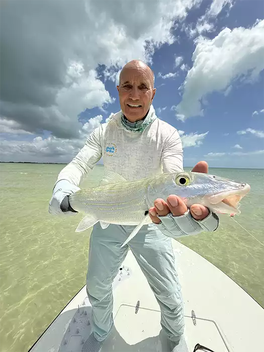 Angler holding a bonefish at ESB Lodge