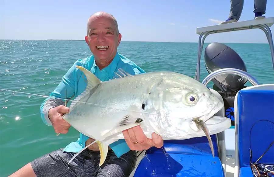 Angler holding a jack at ESB Lodge