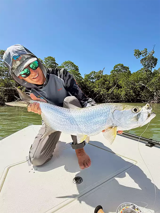 Angler holding a tarpon at ESB Lodge