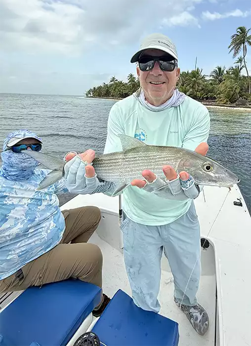 Angler holding a bonefish at ESB Lodge