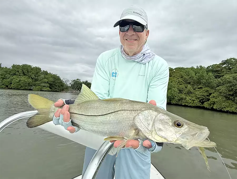 Angler holding a snook at ESB Lodge