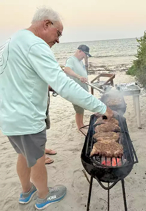 Beachside steak ‘asado’ prepared by John and Tim