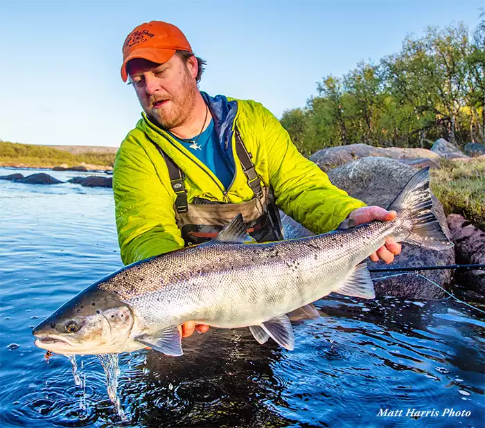 Justin Miller holding an Atlantic salmon on the Kola Reserve