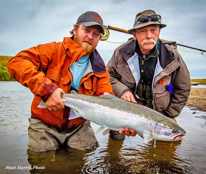Justin Miller and angler holding a steelhead at Kamchatka Steelhead Project