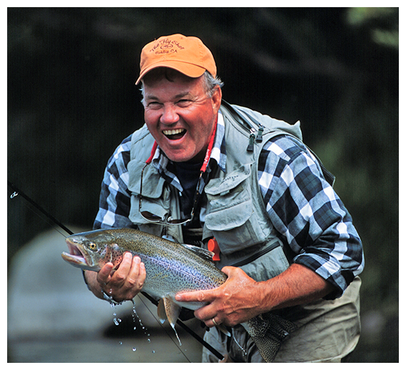 Mike Michalak holding a trout in Kamchatka