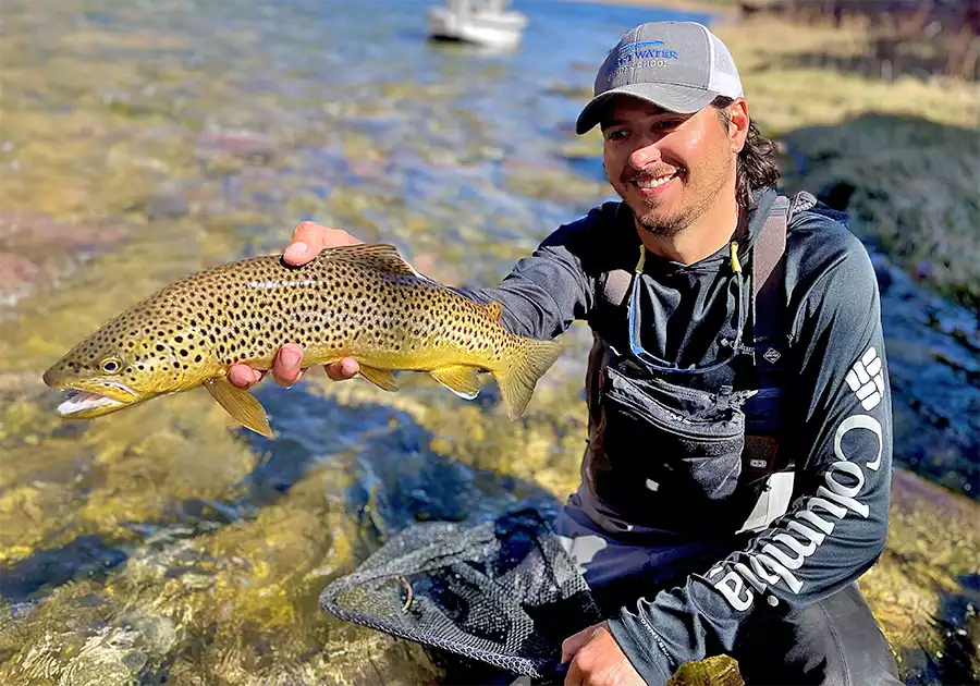 Preston Wedel holding a brown trout