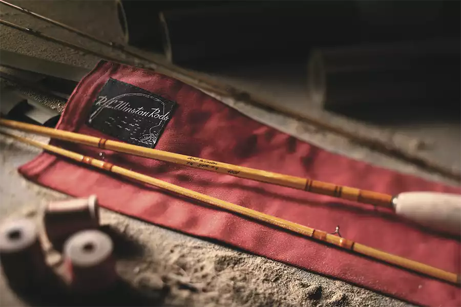 Winston bamboo rod laying on the rod sock on a table