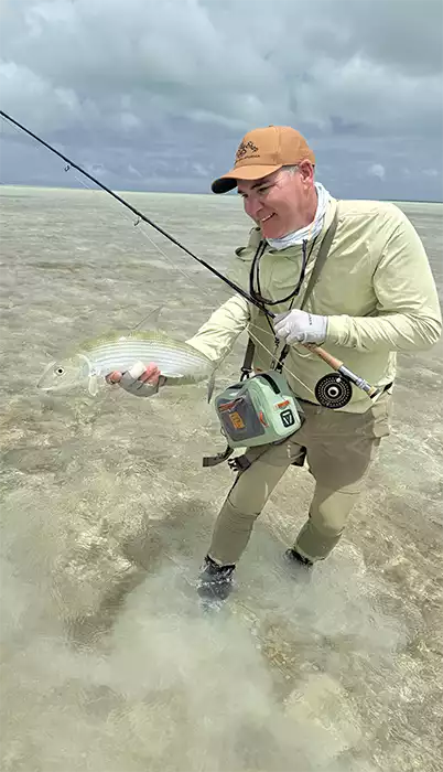 Chris King holding a bonefish in Christmas Island
