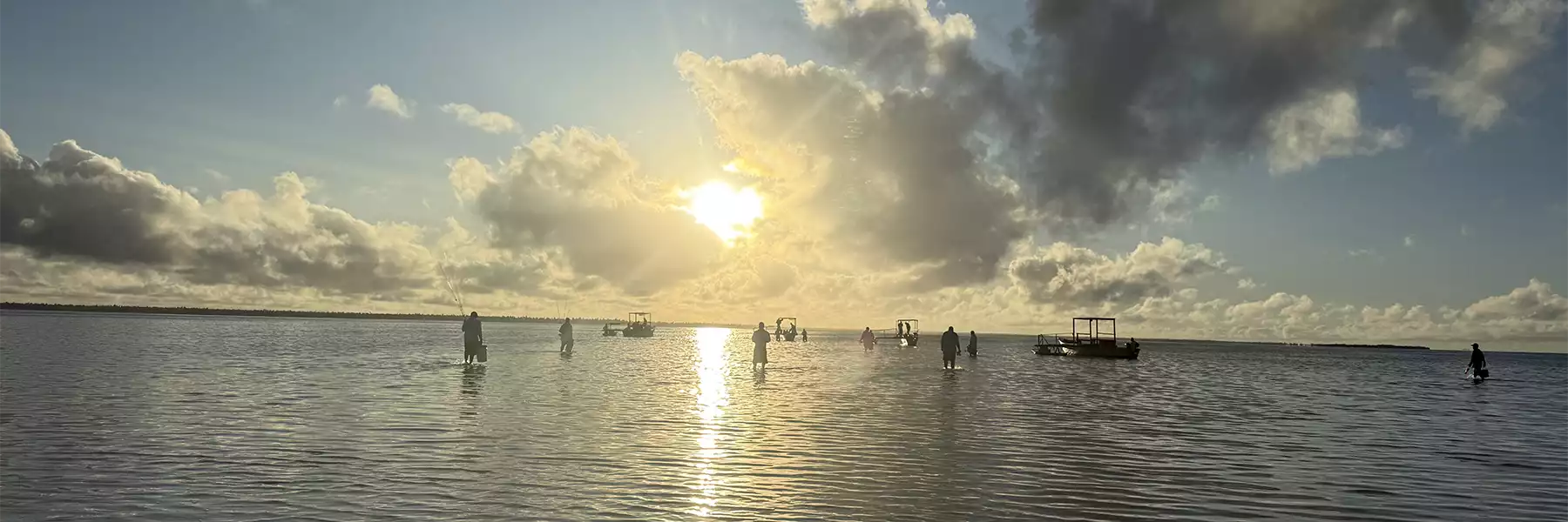 Anglers wading to the boats at Christmas Island