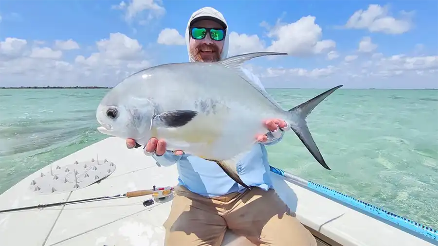 Angler holding a permit at ESB Lodge