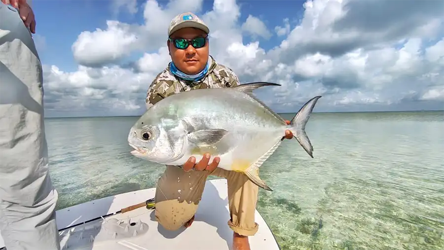 Guide holding a permit at ESB Lodge
