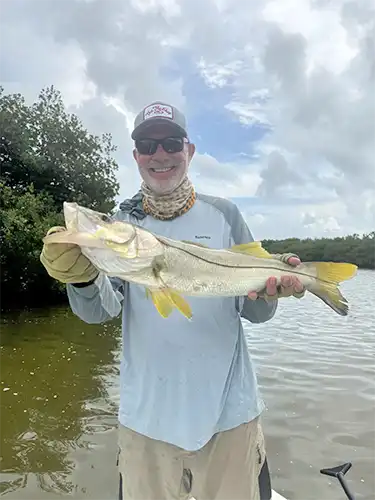 Angler holding a snook at ESB Lodge